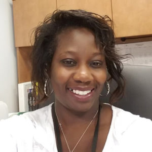 Tasmine Moore with a white top and necklace