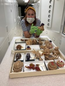 Arina Melkozernova looking at woven baskets