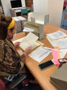 Arina Melkozernova looking at documents