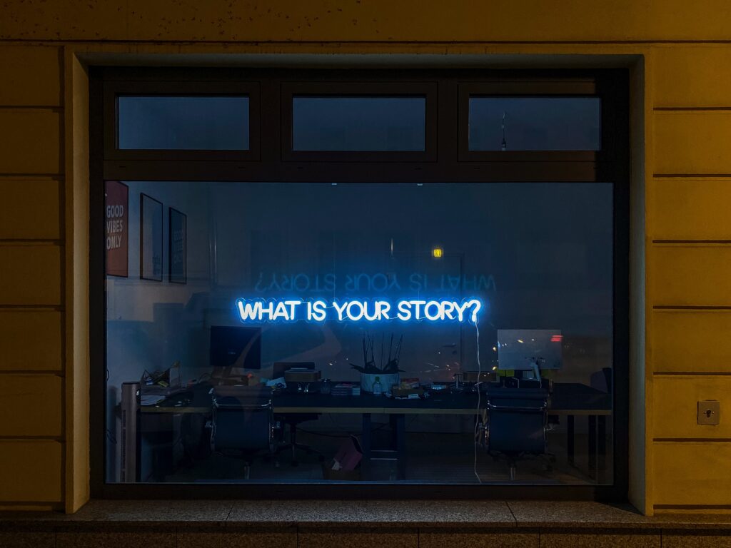 flatscreen tv with text "what is your story?"