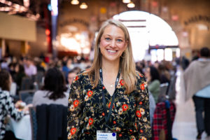 Person looking directly at the camera with blurry background